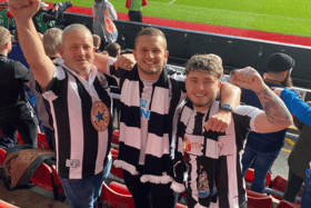Scott (centre), his dad and brother follow Newcastle United from Hampshire.