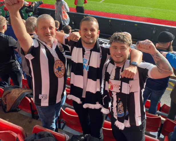 Scott (centre), his dad and brother follow Newcastle United from Hampshire.
