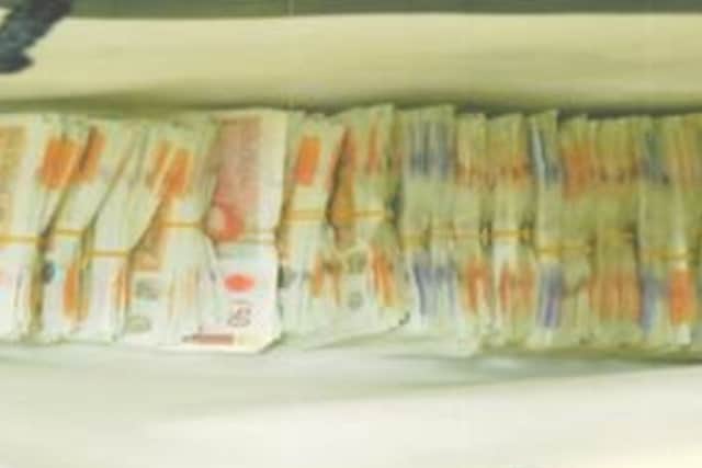 Officers discovered more than £125,000 in cash. 