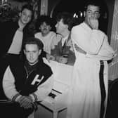 Frankie Goes To Hollywood in 1986. Singer Holly Johnson is seated by the piano, and behind him are (left to right) bassist Mark O’Toole, drummer Peter Gill, guitarist Brian Nash and singer Paul Rutherford. 