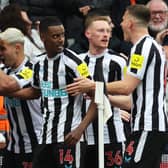 Newcastle United celebrate scoring against Spurs. 