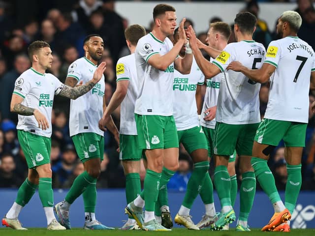 Callum Wilson of Newcastle United celebrates with teammates after scoring the team's first goal during the Premier League match between Everton FC and Newcastle United at Goodison Park on April 27, 2023 in Liverpool, England. (Photo by Gareth Copley/Getty Images)
