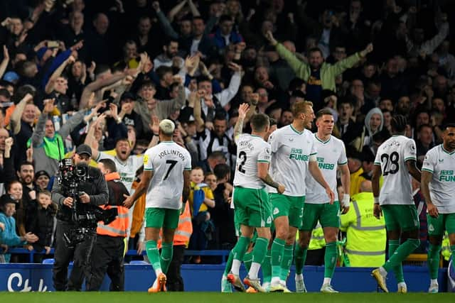 Newcastle United's Brazilian striker Joelinton (L) celebrates scoring the team's second goal during the English Premier League football match between Everton and Newcastle United at Goodison Park in Liverpool, north-west England on April 27, 2023. (Photo by Oli SCARFF / AFP)