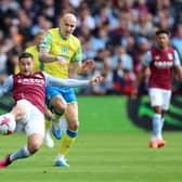 Emi Buendia of Aston Villa is challenged by Jonjo Shelvey of Nottingham Forest during the Premier League match between Aston Villa and Nottingham Forest at Villa Park on April 08, 2023 in Birmingham, England. (Photo by Nathan Stirk/Getty Images)