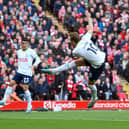Harry Kane of Tottenham Hotspur scores the team’s first goal during the Premier League match between Liverpool FC and Tottenham Hotspur at Anfield on April 30, 2023 in Liverpool, England.