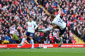 Harry Kane of Tottenham Hotspur scores the team’s first goal during the Premier League match between Liverpool FC and Tottenham Hotspur at Anfield on April 30, 2023 in Liverpool, England.