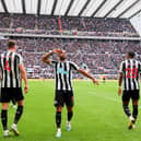 Callum Wilson of Newcastle United (C) celebrates after scoring the team's first goal during the Premier League match between Newcastle United and Southampton FC at St. James Park on April 30, 2023 in Newcastle upon Tyne, England. (Photo by Stu Forster/Getty Images)