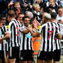 Alexander Isak of Newcastle United ( 2nd from left) celebrates after scoring the team’s fifth goal with team mates during the Premier League match between Newcastle United and Tottenham Hotspur at St. James Park on April 23, 2023 in Newcastle upon Tyne, England. (Photo by Clive Brunskill/Getty Images)