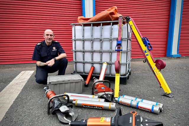 TWFRS Chief Fire Officer Designate Peter Heath with the specialist cutting equipment. 