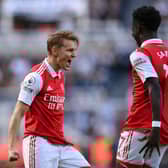  Martin Odegaard of Arsenal celebrates after scoring the team’s first goal with teammate Bukayo Saka during the Premier League match between Newcastle United and Arsenal FC at St. James Park on May 07, 2023 in Newcastle upon Tyne, England. (Photo by Stu Forster/Getty Images)