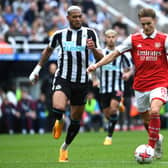 Martin Odegaard of Arsenal is challenged by Joelinton of Newcastle United during the Premier League match between Newcastle United and Arsenal FC at St. James Park on May 07, 2023 in Newcastle upon Tyne, England. (Photo by David Price/Arsenal FC via Getty Images)