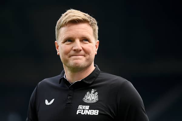 Newcastle manager Eddie Howe looks on and smiles during a match