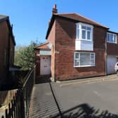 The front of the property features a large driveway which offers plenty of parking for multiple cars