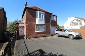 The front of the property features a large driveway which offers plenty of parking for multiple cars