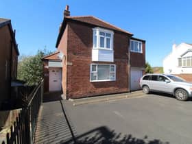 The front of the property features a large driveway which offers plenty of parking for multiple cars