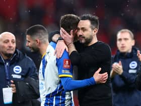 olly March is consoled Roberto De Zerbi, Manager of Brighton & Hove Albion, after the team's defeat in the penalty shoot out during the Emirates FA Cup Semi Final match between Brighton & Hove Albion and Manchester United at Wembley Stadium on April 23, 2023 in London, England. (Photo by Clive Rose/Getty Images)
