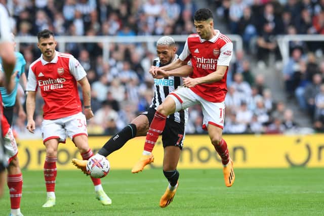 oelinton of Newcastle United battles for possession with Gabriel Martinelli of Arsenal during the Premier League match between Newcastle United and Arsenal FC at St. James Park on May 07, 2023 in Newcastle upon Tyne, England. (Photo by David Price/Arsenal FC via Getty Images)