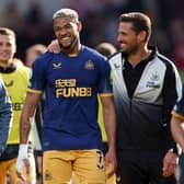 Joelinton and Jason Tindall, Assistant Head Coach of Newcastle United celebrate after the team’s victory in the Premier League match between Brentford FC and Newcastle United at Brentford Community Stadium on April 08, 2023.