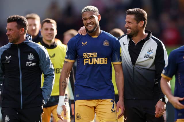 Joelinton and Jason Tindall, Assistant Head Coach of Newcastle United celebrate after the team’s victory in the Premier League match between Brentford FC and Newcastle United at Brentford Community Stadium on April 08, 2023.