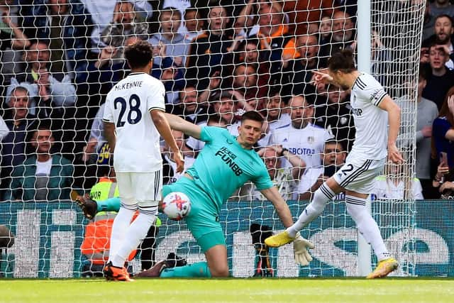 Leeds United's English defender Luke Ayling (R) scores the opening goal during the English Premier League football match between Leeds United and Newcastle United at Elland Road in Leeds, northern England, on May 13, 2023. (Photo by Lindsey Parnaby / AFP)