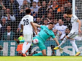Leeds United's English defender Luke Ayling (R) scores the opening goal during the English Premier League football match between Leeds United and Newcastle United at Elland Road in Leeds, northern England, on May 13, 2023. (Photo by Lindsey Parnaby / AFP)