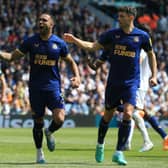 Newcastle United's English striker Callum Wilson celebrates with Newcastle United's Swiss defender Fabian Schar (R) after scoring a penalty during the English Premier League football match between Leeds United and Newcastle United at Elland Road in Leeds, northern England, on May 13, 2023. (Photo by Lindsey Parnaby / AFP) 