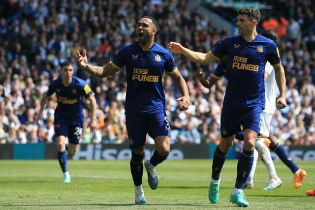 Newcastle United's English striker Callum Wilson celebrates with Newcastle United's Swiss defender Fabian Schar (R) after scoring a penalty during the English Premier League football match between Leeds United and Newcastle United at Elland Road in Leeds, northern England, on May 13, 2023. (Photo by Lindsey Parnaby / AFP)