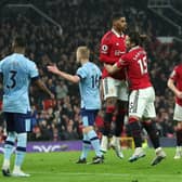 Marcus Rashford of Manchester United celebrates with teammate Marcel Sabitzer after scoring the team's first goal during the Premier League match between Manchester United and Brentford FC at Old Trafford on April 05, 2023 in Manchester, England. (Photo by David Rogers/Getty Images)
