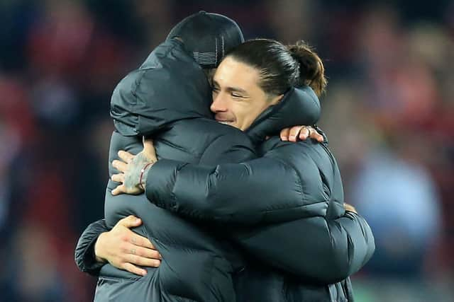 Liverpool boss Jurgen Klopp hugs Uruguayan forward Darwin Nunez.  (Photo by LINDSEY PARNABY/AFP via Getty Images)