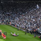 A general view of the inside of the stadium as players of Newcastle United and Arsenal line up prior to the Premier League match between Newcastle United and Arsenal FC at St. James Park on May 07, 2023 in Newcastle upon Tyne, England. 