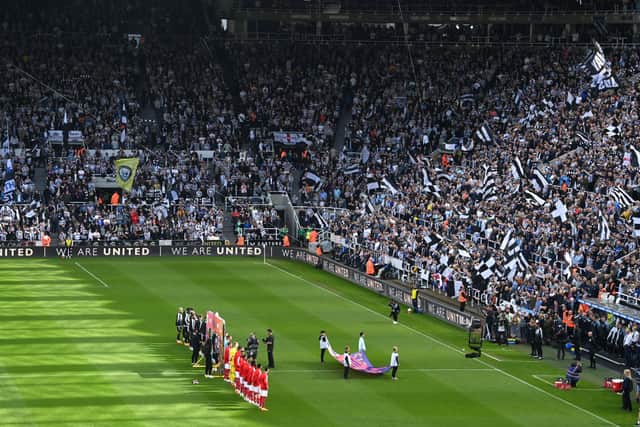 A general view of the inside of the stadium as players of Newcastle United and Arsenal line up prior to the Premier League match between Newcastle United and Arsenal FC at St. James Park on May 07, 2023 in Newcastle upon Tyne, England.
