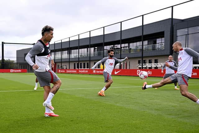 Roberto Firmino, Fabinho and Mohamed Salah of Liverpool during a training session at AXA Training Centre on May 17, 2023 in Kirkby, England. (Photo by Andrew Powell/Liverpool FC via Getty Images)