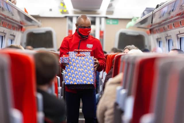 Titani Kamphandira, LNER Customer Experience Host, returns professionally wrapped presents to launch the rail operators complimentary Rail Wrapping service (photo: David Parry/PA Wire)