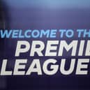 The logo is pictured through a glass window at the headquarters of the English Premier League in London on March 13, 2020. 