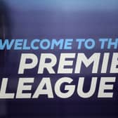 The logo is pictured through a glass window at the headquarters of the English Premier League in London on March 13, 2020. 