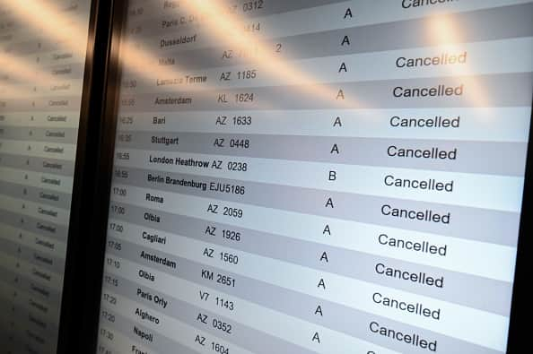 A screen shows cancelled flights at Milan Linate Airport in Milan, Italy on October 21, 2022 due to strike (Photo by Piero Cruciatti/Anadolu Agency via Getty Images)