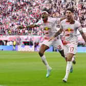 Dominik Szoboszlai of RB Leipzig celebrates with teammate Mohamed Simakan after scoring the team’s second goal during the Bundesliga match between RB Leipzig and SV Werder Bremen at Red Bull Arena on May 14, 2023 in Leipzig, Germany. 