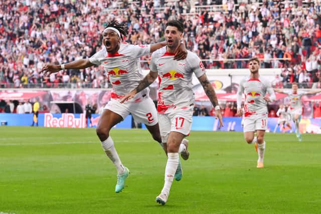 Dominik Szoboszlai of RB Leipzig celebrates with teammate Mohamed Simakan after scoring the team’s second goal during the Bundesliga match between RB Leipzig and SV Werder Bremen at Red Bull Arena on May 14, 2023 in Leipzig, Germany.