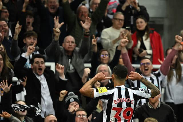 Newcastle United's Brazilian midfielder Bruno Guimaraes celebrates after scoring his team fourth goal during the English Premier League football match between Newcastle United and Brighton and Hove Albion at St James' Park in Newcastle-upon-Tyne, north east England on May 18, 2023. (Photo by Oli SCARFF / AFP) / RESTRICTED TO EDITORIAL USE. No use with unauthorized audio, video, data, fixture lists, club/league logos or 'live' services. Online in-match use limited to 120 images. An additional 40 images may be used in extra time. No video emulation. Social media in-match use limited to 120 images. An additional 40 images may be used in extra time. No use in betting publications, games or single club/league/player publications. /  (Photo by OLI SCARFF/AFP via Getty Images)