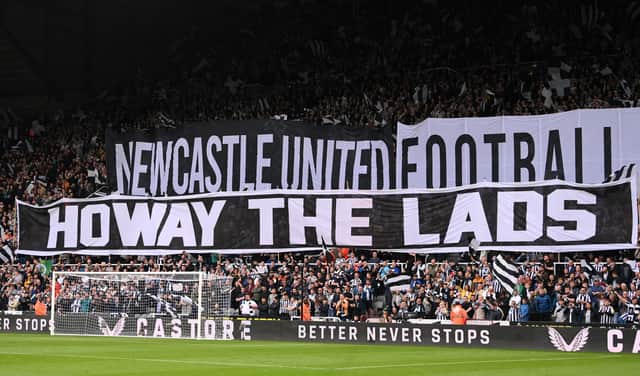 NEWCASTLE UPON TYNE, ENGLAND - MAY 18: Fans of Newcastle United display a 'Howay the lads' tifo banner prior to the Premier League match between Newcastle United and Brighton & Hove Albion at St. James Park on May 18, 2023 in Newcastle upon Tyne, England. (Photo by Stu Forster/Getty Images)