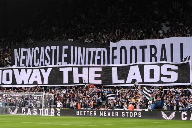 NEWCASTLE UPON TYNE, ENGLAND - MAY 18: Fans of Newcastle United display a 'Howay the lads' tifo banner prior to the Premier League match between Newcastle United and Brighton & Hove Albion at St. James Park on May 18, 2023 in Newcastle upon Tyne, England. (Photo by Stu Forster/Getty Images)