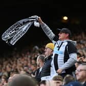 NEWCASTLE UPON TYNE, ENGLAND - MAY 18: Fans of Newcastle United celebrate their side's second goal scored by Dan Burn of Newcastle United (not pictured) during the Premier League match between Newcastle United and Brighton & Hove Albion at St. James Park on May 18, 2023 in Newcastle upon Tyne, England. (Photo by Stu Forster/Getty Images)