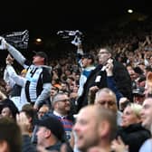 NEWCASTLE UPON TYNE, ENGLAND - MAY 18: Newcastle fans wave their scarves after the first goal during the Premier League match between Newcastle United and Brighton & Hove Albion at St. James Park on May 18, 2023 in Newcastle upon Tyne, England. (Photo by Stu Forster/Getty Images)
