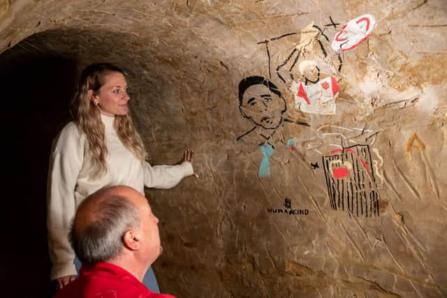 72 POINT LTD Artist Emmy Smith creates modern cave paintings with the help of cave expert Paul Pettit at Hellfire Caves, West Wycombe, Buckinghamshire, August 12 2021