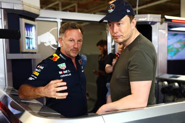 Red Bull Racing Team Principal Christian Horner talks with Elon Musk in the Paddock prior to final practice ahead of the F1 Grand Prix of Miami at Miami International Autodrome