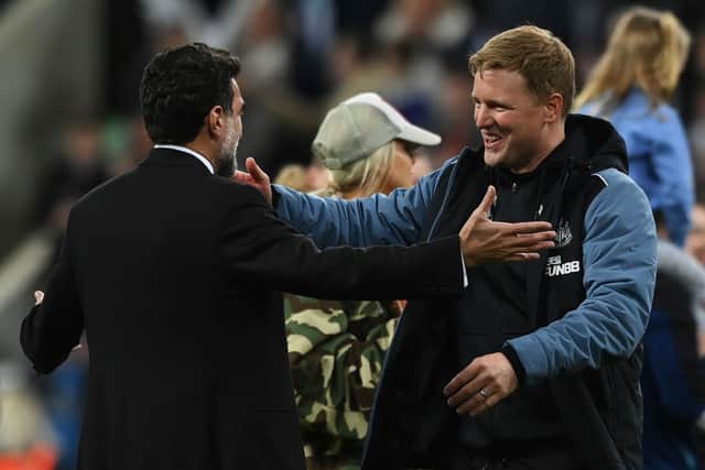 Eddie Howe, Manager of Newcastle United, and Yasir Al-Rumayyan chairman of Newcastle United interact after their team qualifies for the UEFA Champions League following the Premier League match between Newcastle United and Leicester City at St. James Park on May 22, 2023 in Newcastle upon Tyne, England. (Photo by Stu Forster/Getty Images)