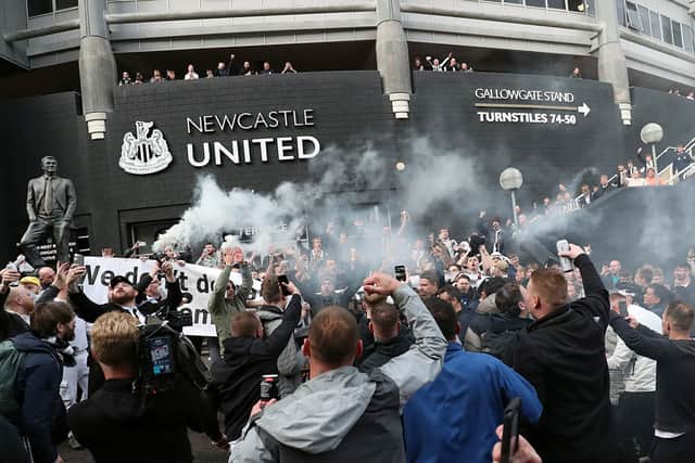 Newcastle United fans celebrate Mike Ashley selling the club in October 2021 (Image: Getty Images)