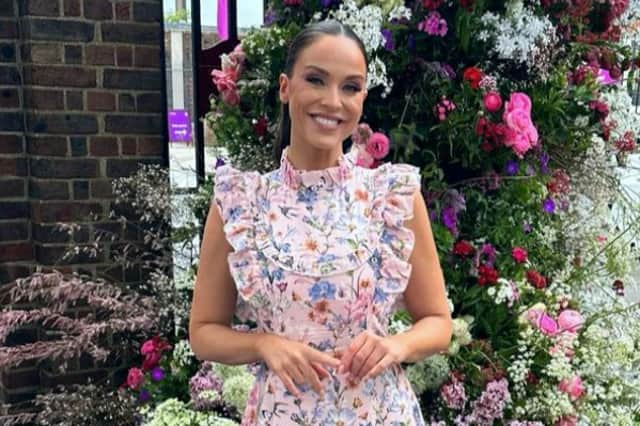 Vicky wore a pink floral dress with a ruffle neck and sleeves from British luxury brand  Anne Louise Boutique. (Picture: Instagram/@vickypattison)