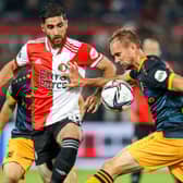 Feyenoord’s Iranian forward Alireza Jahanbakhsh (L) fights for the ball with Heerenveen’s Dutch midfielder Siem de Jong during the Dutch Eredivisie football match between Feyenoord and SC Heerenveen at Feyenoord Stadium de Kuip in Rotterdam, on September 22, 2021. 