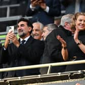 Newcastle United’s Saudi Arabian chairman Yasir Al-Rumayyan (L) and Newcastle United’s English minority owner Amanda Staveley (C) applaud the players ahead of the English League Cup final football match between Manchester United and Newcastle United at Wembley Stadium, north-west London on February 26, 2023. 
